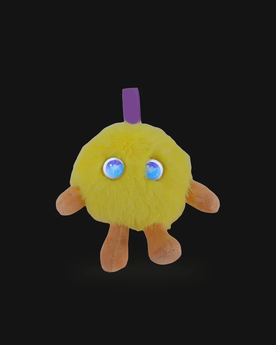 Blinkpal in Lemon with its LED eyes on, on a graphite plate